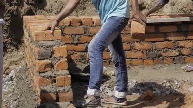 Efficient Bricks - A Skilled Artisan Crafting Sturdy Walls