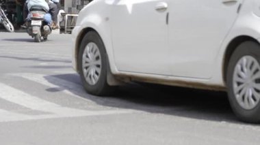 Driving City Streets - White Car in Motion