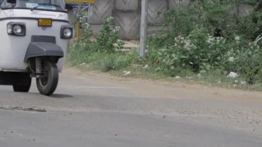 Vehicle in Motion - Urban Deliveries on a Quiet Street