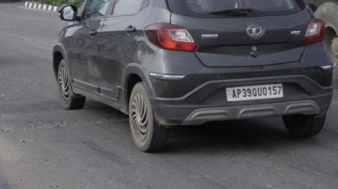 Sleek Car's Journey on the Asphalt - A Moment Caught in Motion