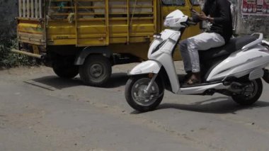 Scooting through the Streets - A Journey on a White Motorcycle