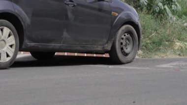 Parked on the Side of the Road - A Still Life with Car and Bricks