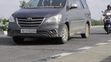 Adventurous Drive - Toyota SUV Cruises Ahead of Scooter on City Road