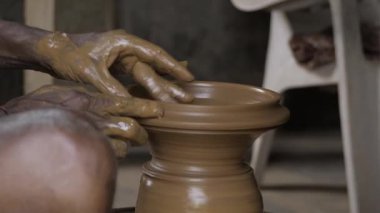 Creating Ceramic Masterpieces - A Potter's Hand in Clay
