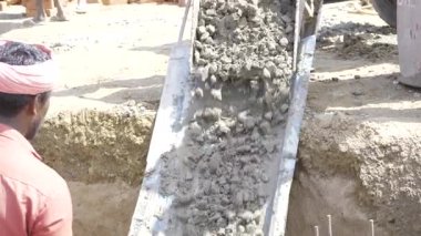 Cement Mixing in Progress - Construction Worker at Work