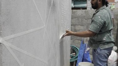 Painter Ensuring Even Coat with Great Attention to Detail