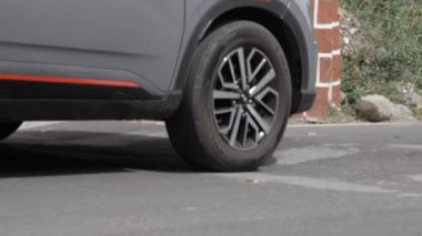 Contemplating the Edge of the Road - A Moment with the SUV's Tire