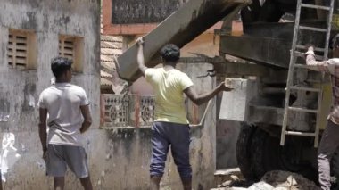 Diligent Work - Men Constructing with Cement Blocks