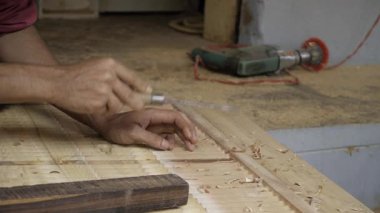 Precision Woodworking - Expert Hand at Work