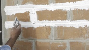 Hand Skilled Cement Plastering on Brick Wall