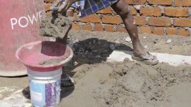 Efficient Cement Mixing Technique - Expert Hands in Action