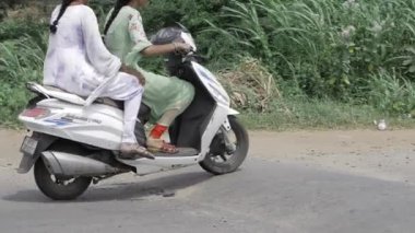 Double Riding Adventure - Two Women on a Scooter