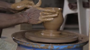 Mastering the Art - Expert Potter Crafts a Sculpture