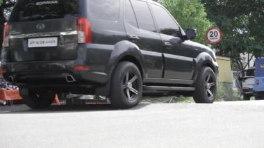 Exploring the Outdoors - A Journey Through a Serene Forest with a Black SUV