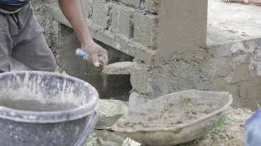 Efficient Cement Mixing for Strong Foundations - A Skillful Worker in Action