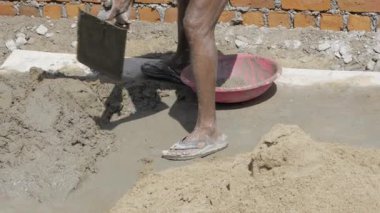Efficient Cement Mixing with a Shovel