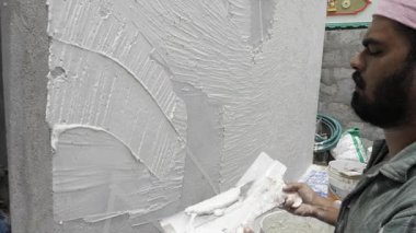 Expert's Hand at Work - Plastering with Precision