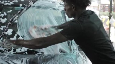 Hand Washing a Car with Foamy Soap