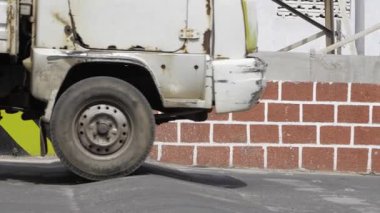 Old Vehicle on Bricks - A Street Scene
