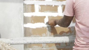 Efficient Plastering Technique - Expert Hands at Work