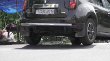 Vehicle's Journey Along a Quiet Street - A View from the Rear