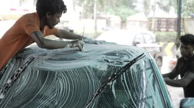 Vigorous Car Washing in Progress - Shiny Clean in No Time
