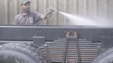 Precision Auto Care - Expert Mechanic Cleaning a Car Engine