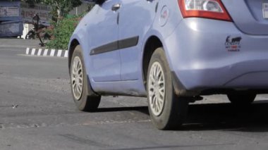 Navigating Urban Streets - A Moment of a Compact Car in Motion