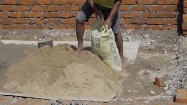Man Handling Cement Bag - Construction Site Labor