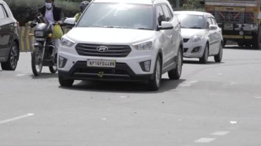 City Traffic - Cars, Trucks, and Scooters in Motion