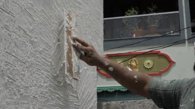 Masterful Hand Plastering a Wall with Precision