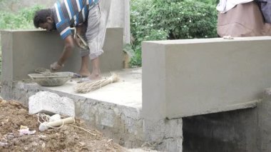 Hard Work and Sweat - Building a Foundation with Cement and Dirt