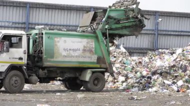 The Garbage Tractor at Work - Sorting Through the Trash
