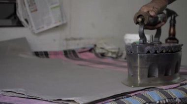 Craftsman's Hand at Work - Ironing with Precision and Skill