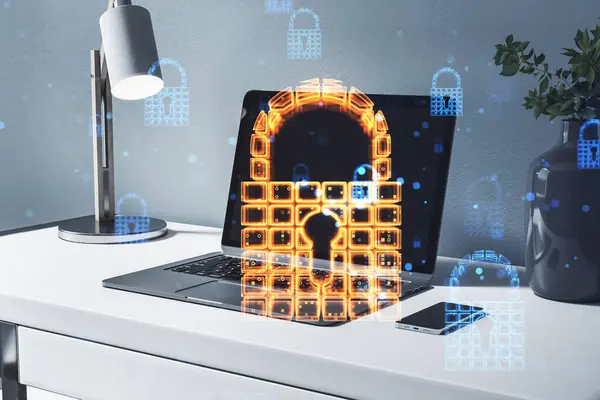 Close up of workplace with laptop, various other items and glowing security padlock on background. Secure, safety and digital protection concept. Double exposure