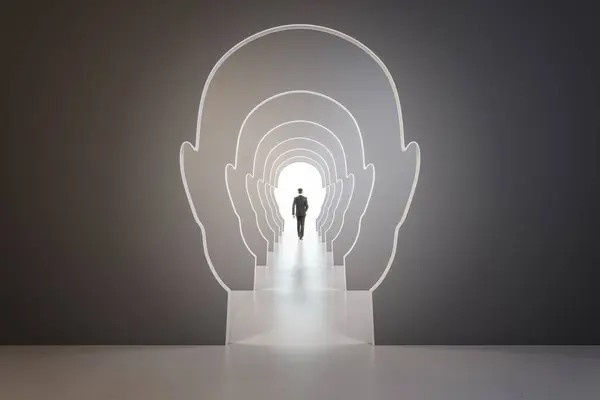 Creative image of businessman walking through head outline corridor. Thinking, maze, solution and answer search concept