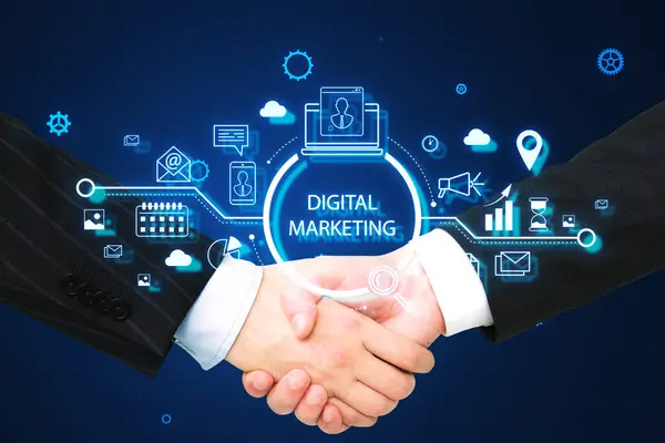 Close up of businessmen handshake with creative glowing marketing hologram. Digital online marketing commerce sale and partnership concept