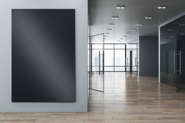 Contemporary new office corridor interior with glass windows and city view, wooden flooring and empty black mock up poster on wall. Commercial and workplace, gallery concept. 3D Rendering