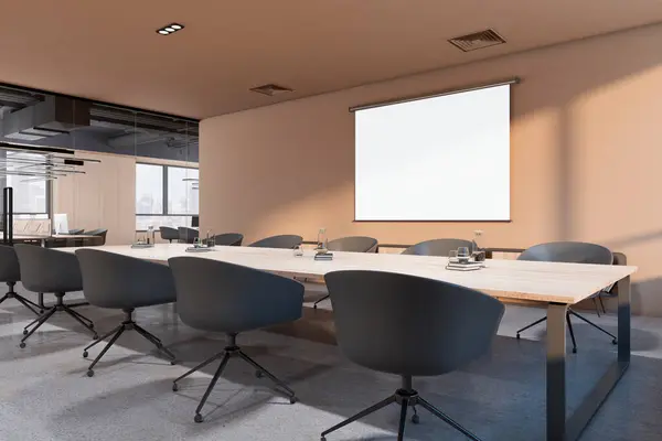 Perspective view on blank white projector screen with space for your logo or text on light wall in sunlit conference room with wooden meeting table and grey chairs around. 3D rendering, mock up