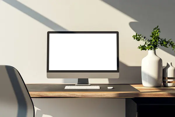Minimalist computer setup on wooden desk with stylish lamp and plant decor. Creative workspace concept. 3D Rendering