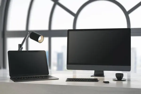 Close up of daylight designer desktop with empty laptop computer screens, coffee cup and keyboard on wooden desktop and window with city view background. Mock up, 3D Rendering