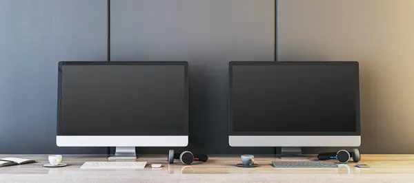Two empty gaming computer displays on table with coffee cups and headsets. Place for your advertisement. Gaming club concept. Mock up, 3D Rendering