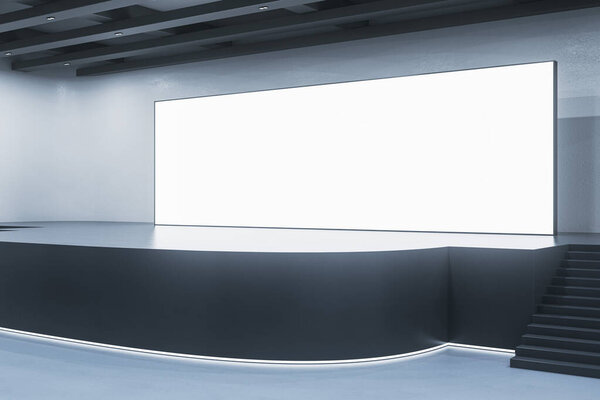 Contemporary exhibition hall interior with illuminated empty white mock up billboard on stage. Auditorium and advertisement concept