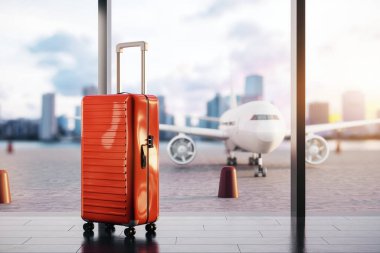 Havaalanı salonunda, güneşli bir günde seyahat ve macerayı sembolize eden asfalt manzaralı kırmızı bavul. 3B Hazırlama