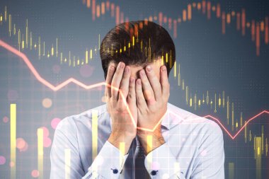 Stressed young businessman with falling forex chart on blurry background. Crisis and finance concept. Double exposure clipart