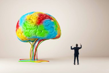 A man in a suit admires a large, colorful brain sculpture with flowing wires on a minimalist background, symbolizing creativity or inspiration clipart