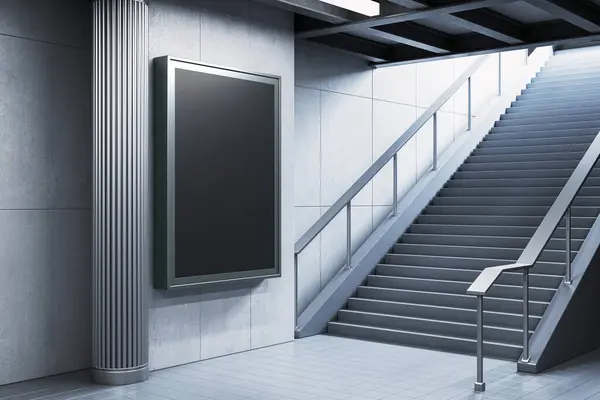 stock image Blank advertising board on a wall beside a modern staircase in a subway station. Indoor, architectural setting with a sleek, contemporary design. 3D Rendering.