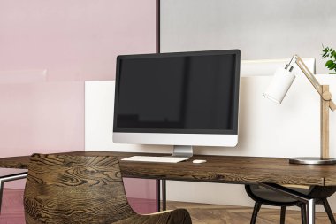 A sleek workspace with a wooden desk, large computer monitor, and desk lamp in a modern office interior setting, emphasizing a business concept. 3D Rendering. clipart