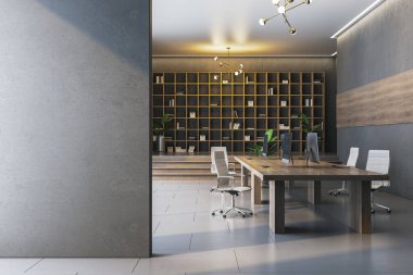 Ofis içi kitaplık, modern tarz, gri arka plan. İş yeri kavramı. 3B Hazırlama