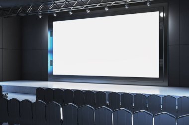 Modern karanlık oditoryumda boş siyah sandalyelerle dolu büyük, boş bir sinema modeli. Sahne yukarıdaki ışıklarla aydınlatılıyor. 3B Hazırlama